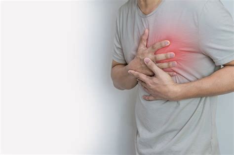 Hands holding chest with symptom heart attack disease – Artofit