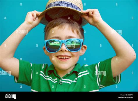 Smiling Boy Wearing Straw Hat and Sunglasses Stock Photo - Alamy