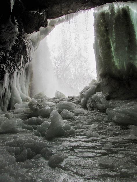 I found an ice cave behind a waterfall on my hike earlier today : r/pics