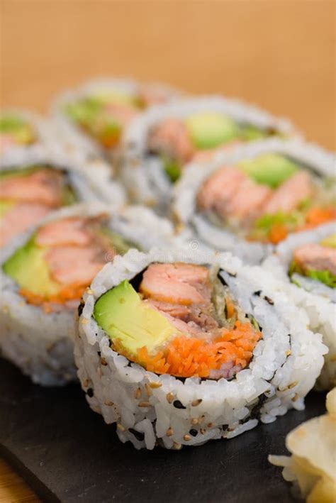 Salmon, Avocado and Carrot Sushi Roll Served on a Slate Plate with Ginger and Wasabi Stock Photo ...