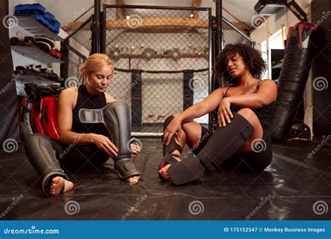 Two Female Mixed Martial Arts Fighters Putting on Protective Equipment ...