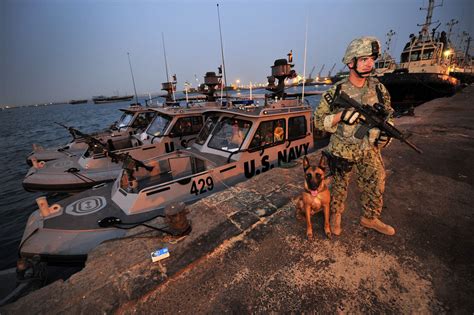 Master-at-Arms 2nd Class John Winjum stands duty at the Po… | Flickr