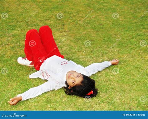 Girl Laying on Grass stock photo. Image of outside, outdoor - 4454744