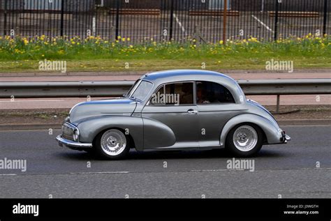 A modified 1949-50 Morris Minor car travelling along the Kingsway West dual carriageway in ...