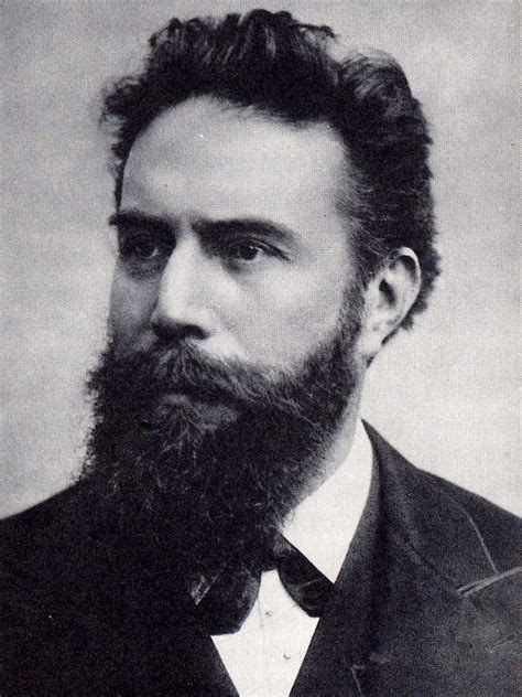 an old black and white photo of a man with a beard