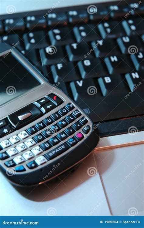 Pda Phone on Laptop Keyboard Stock Photo - Image of executive ...