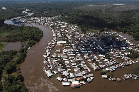 In pictures: Rising Amazon rivers flood Covid-hit areas in Brazil - BBC ...