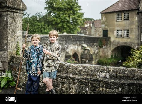 Two brothers stand next to the river Chew at Pensford Bridge in ...