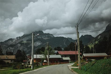 Premium Photo | Majestic mountains in the alps covered with trees and clouds