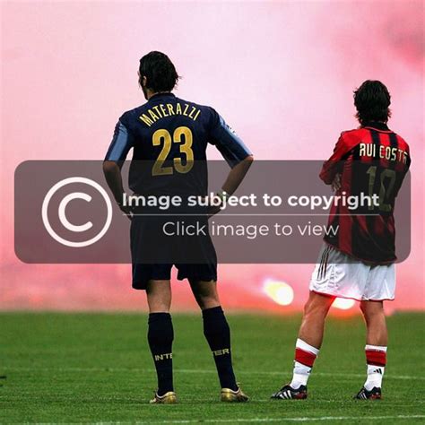 Marco Materazzi of Inter Milan and Rui Costa of AC Milan look on as ...