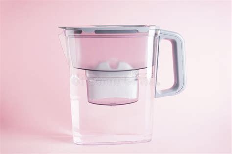 Water Filter Jug of Water on a Pink Background Stock Photo - Image of cartridge, container ...