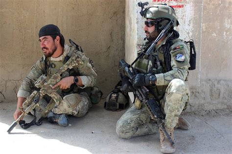 Afghan army commandos rest Tuesday during fighting in Kunduz between Taliban militants and ...