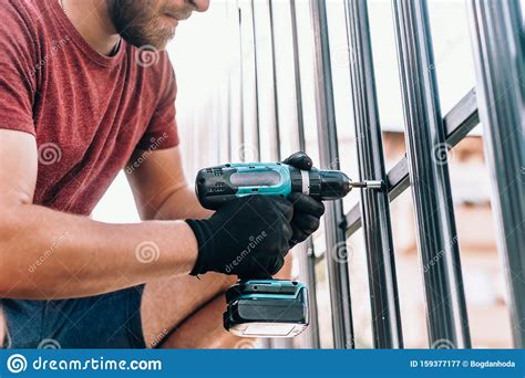 Male Worker with Cordless Screwdriver Power Tool Fastening Screws Stock Image - Image of ...