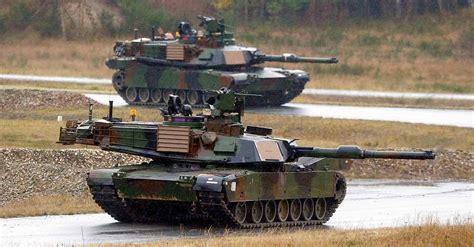 U.S. Soldiers take part in an exercise in M1A2 Abrams tanks, alongside ...