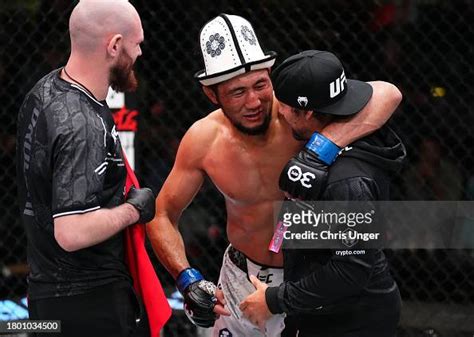 Myktybek Orolbai of Kyrgyzstan celebrates with coach Urijah Faber ...