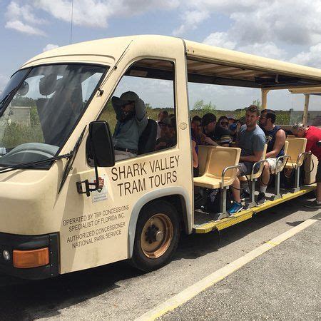 a tour bus with people sitting in it