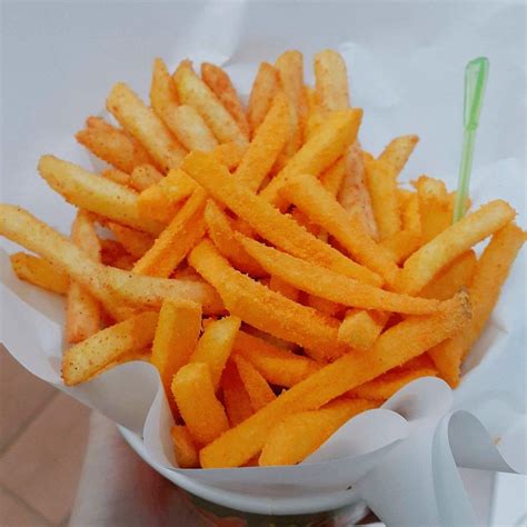 french fries in a white bowl on a table
