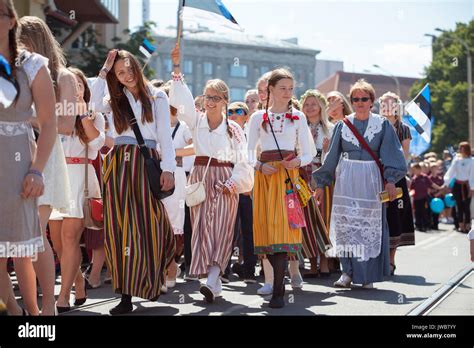 TALLINN, ESTONIA - 04 JUL 2014: People in Estonian costumes going at ...