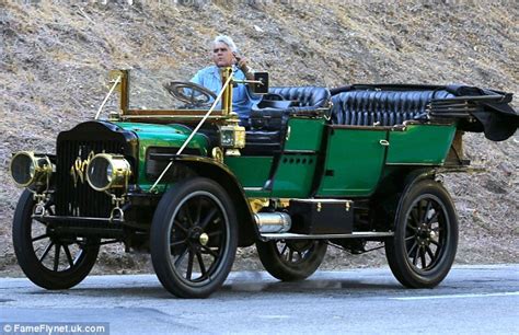 Jay Leno enjoys the wind in his hair as he shows-off one of his steam ...