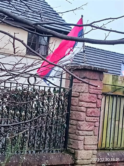 Some sort of Serb flag with DoubleHeaded Eagle and cyrillic text within Circle : r/vexillology