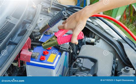 Hand holding jumper cable stock image. Image of line - 67192523