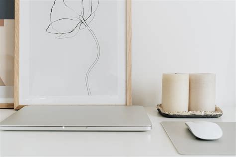 A Laptop and Mouse with Pad on the Table · Free Stock Photo