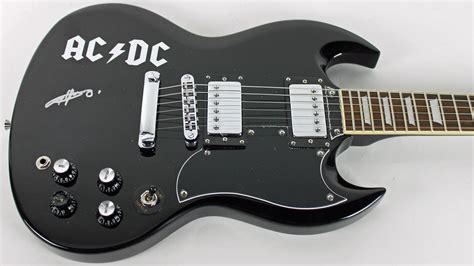 Lot Detail - AC/DC: Angus Young Signed Epiphone SG Style Guitar (PSA/DNA)