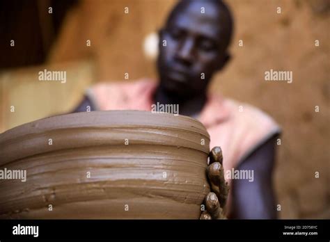 Khartoum, Sudan. 20th Oct, 2020. A Sudanese potter makes a clay pot in ...