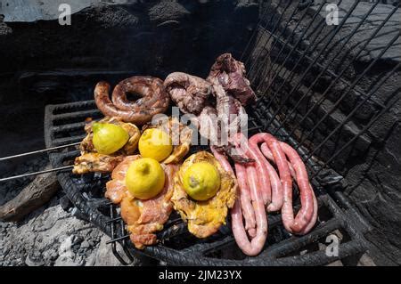 Typical Uruguayan and Argentine Asado Cooked on fire. Entrana and Vacio ...