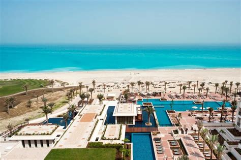 View of St. .Regis Saadiyat's pool area and beachfront. Luxury Beach Resorts, Beach Hotels, Abu ...