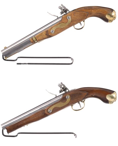 At Auction: TWO BLACK POWDER FLINTLOCK PISTOLS