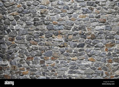 Old style rough stone rock wall texture Stock Photo - Alamy