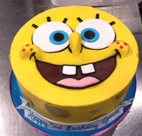 a spongebob birthday cake with eyes and mouth