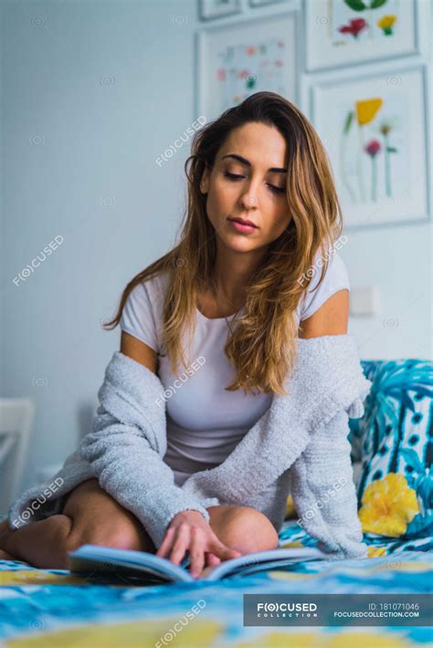 Portrait of woman reading book on bed — education, living - Stock Photo ...