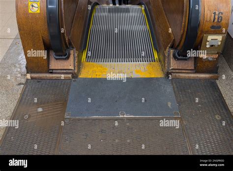 Close up view of wooden escalator stairs down in department store. New ...