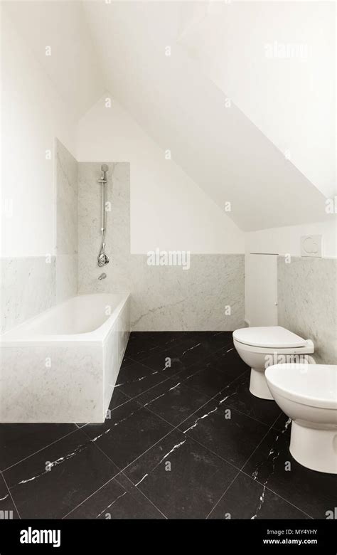 Interior, bathroom with black marble floor Stock Photo - Alamy