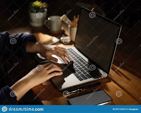 Side View of Female Hand Typing on Laptop on Wooden Table Stock Image ...