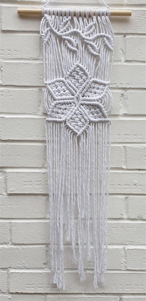 Daisy chain // Macrame flower wall hanging in white // flower | Etsy in 2020 | Woven wall ...