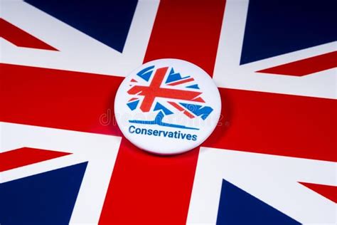 Conservative Party Badge over the UK Flag. London, UK - November 18th 2018: A Co #Sponsored , # ...