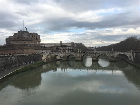 On of the bridges passing over the Tiber river in Rome creating quite a ...