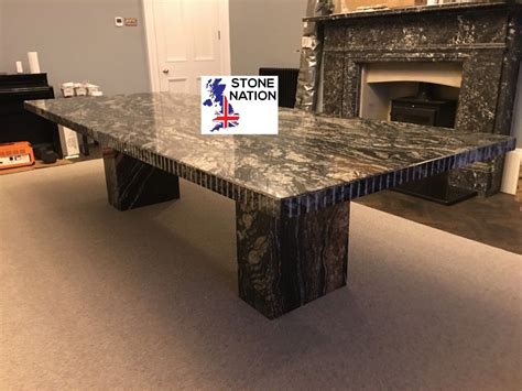 a marble table in front of a fireplace