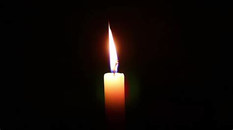 Candle flame against isolated black background 8704541 Stock Video at ...