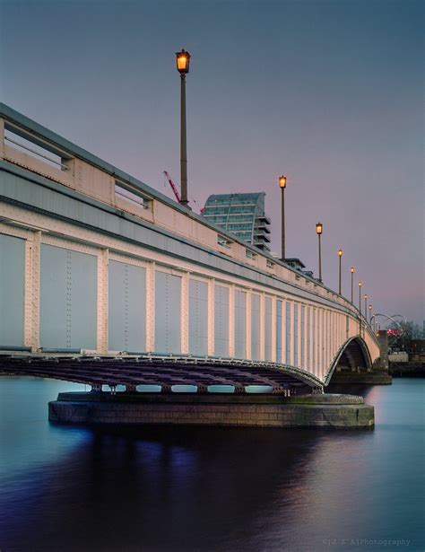 Wandsworth Bridge (London) is still painted in dull shades of blue as camouflage against air ...