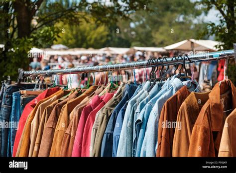 vintage clothing , retro jackets and shirts / second hand fashion on flea market Stock Photo - Alamy