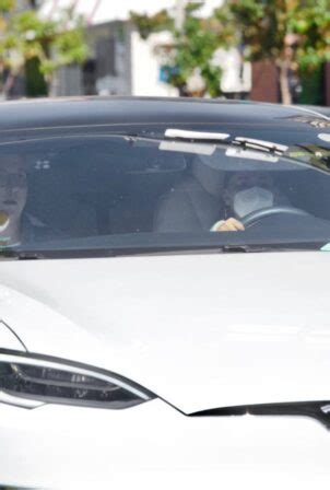 Ariana Grande – Driving Tesla in Los Angeles | GotCeleb