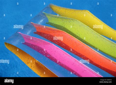 Colourful lilo in swimming pool Stock Photo - Alamy