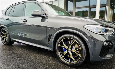 X5 45e in Individual Dravit Grey with 21" 741M Night Gold wheels