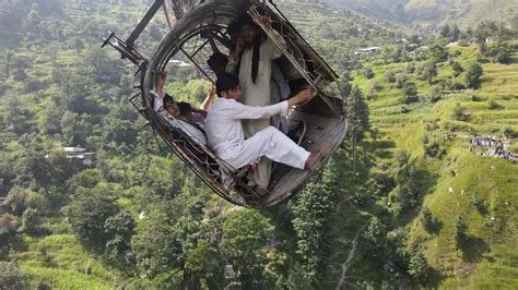 Pakistan: Drone shows children trapped in cable car dangling over river canyon | World News ...