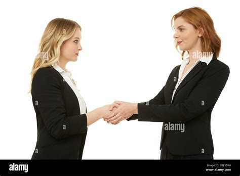 Two business women shaking hands Stock Photo - Alamy