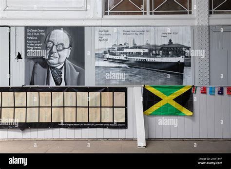 Windrush Day display at Tilbury Docks cruise ferry terminal, including Jamaica flag & images of ...